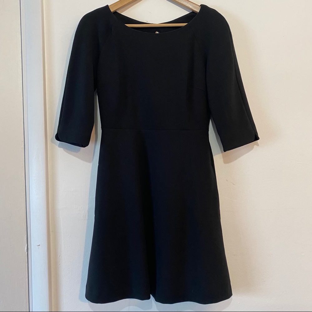 Sweet little black dress with open back